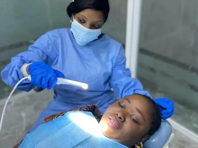 Dentist examining a patient at Royal Aesthetics Dental Clinic