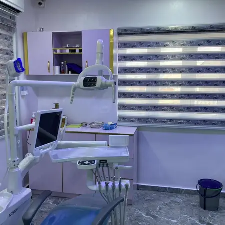 Dental treatment room with chair and monitor