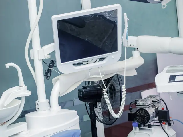 Dental chair with digital display in a treatment room