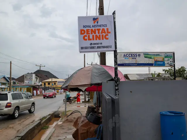 Royal Aesthetics Dental Clinic signboard at Alhaji Agba Bus Stop in Magboro